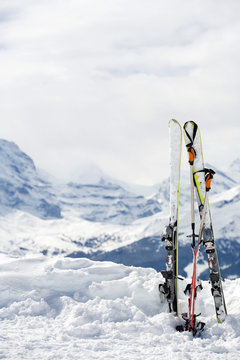 Ski with lots of copy space. Mountains in background