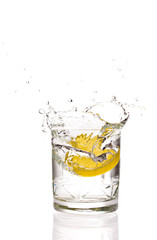 Lemon splashing in martini glass