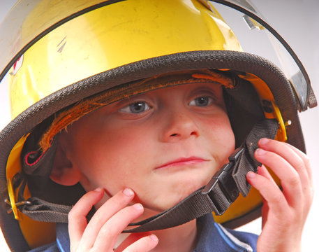 Child in Fireman's Helmet