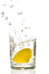 Fototapeta na wymiar Lemon splashing in martini glass