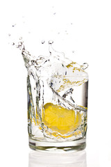 Lemon splashing in martini glass