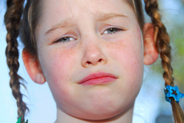 Unhappy Girl in Braids