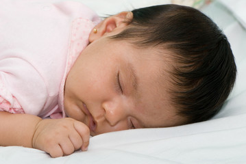 Obraz na płótnie Canvas The sleeping girl 2 months