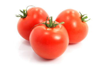 three fresh tomatoes on white background