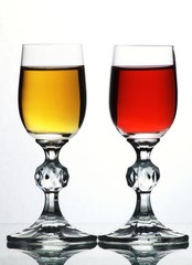 Two glasses with red and yellow liquid