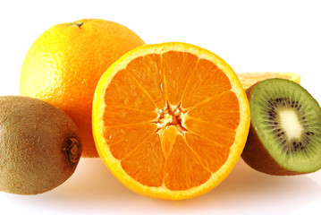 close up of oranges and kiwi fruits