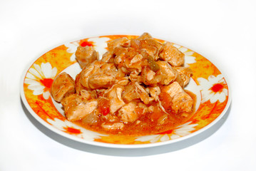 meat in piquant sauce isolated on plate