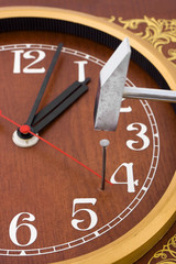 Clock, hammer and nail