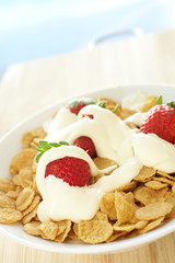 Breakfast cereal with strawberries and cream