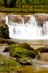 Water falling over red rocks