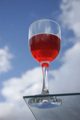Red wine against the blue sky
