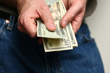 Man counting US dollars