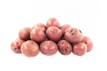 Red mini potatoes over white background.