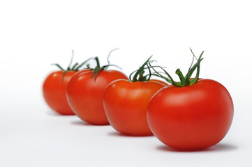 Fresh four tomato isolated on white background