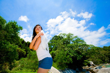 woman with white angle wings looking up to the sky