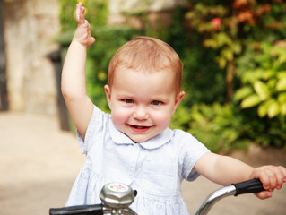 Portrait of cute kid with bike