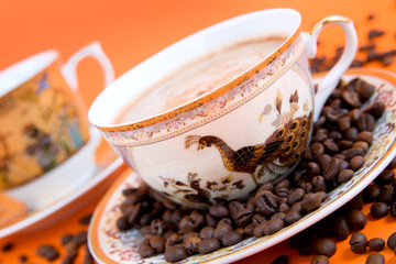 cup of coffee with coffee grain