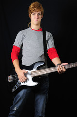 Portrait of casual teen with electric bass