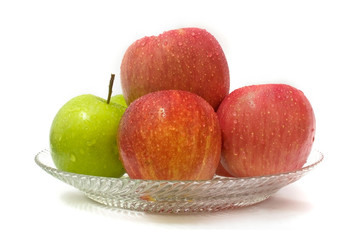 Green apple among red apple