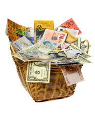 Basket full of currency notes of various countries
