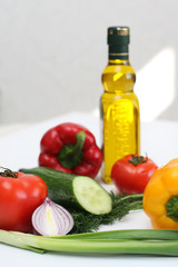 Multi-coloured vegetables for salad on a white background