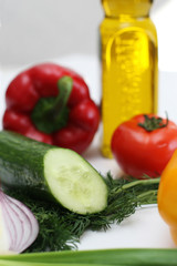 Multi-coloured vegetables for salad on a white background