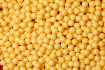 A pile of yellow round balls.