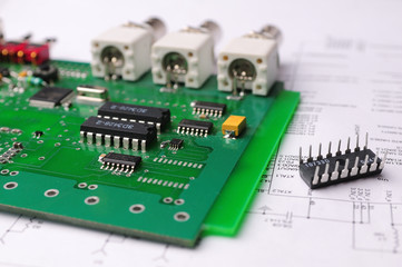 Close-up on a microchip on a scheme background