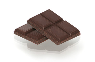 Two segments of chocolate on a white background