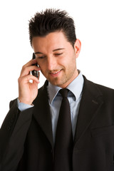 Young businessman talking on mobile phone