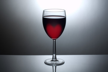 Glass of wine with heart shaped glow