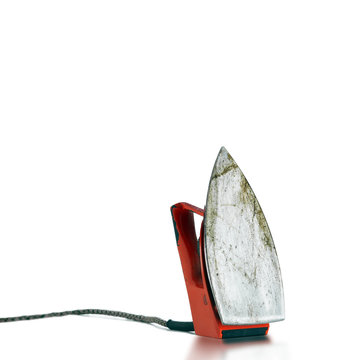 An electric red retro iron from bottom