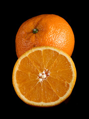 Fresh oranges on black background