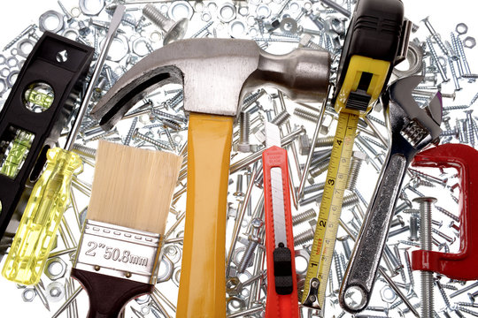 Assorted tools over white background