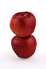 Two stacked red apples