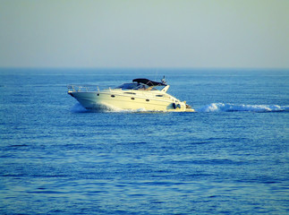 Naklejka premium A fast speedboat on blue sea