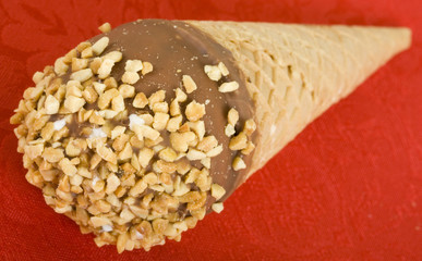Ice Cream Cone With Milk Chocolate And Roasted Peanuts