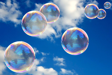 Soap bubbles on blue sky - Powered by Adobe