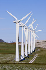 Wind turbines in line on a windfarm