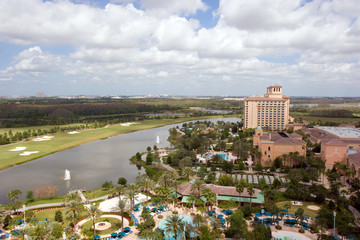 Resort with hotel, pool, golf course and lake, taken from above