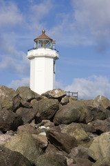 Lighthouse Peaks Above Rocks