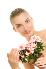 Fototapeta premium Beautiful young woman with a flower isolated on white background