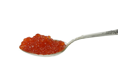 Silver spoon full of red caviar