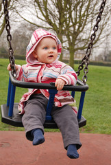 baby girl in a swing