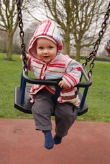 baby girl in a swing