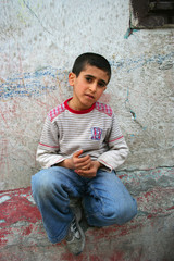 Boy sitting on the wall