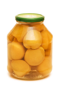 Jar with peaches isolated on the white
