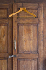 Wooden Hanger On Antique Closet
