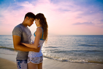 loving couple on a beautiful sunset beach