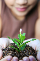 Girl Holding Plant